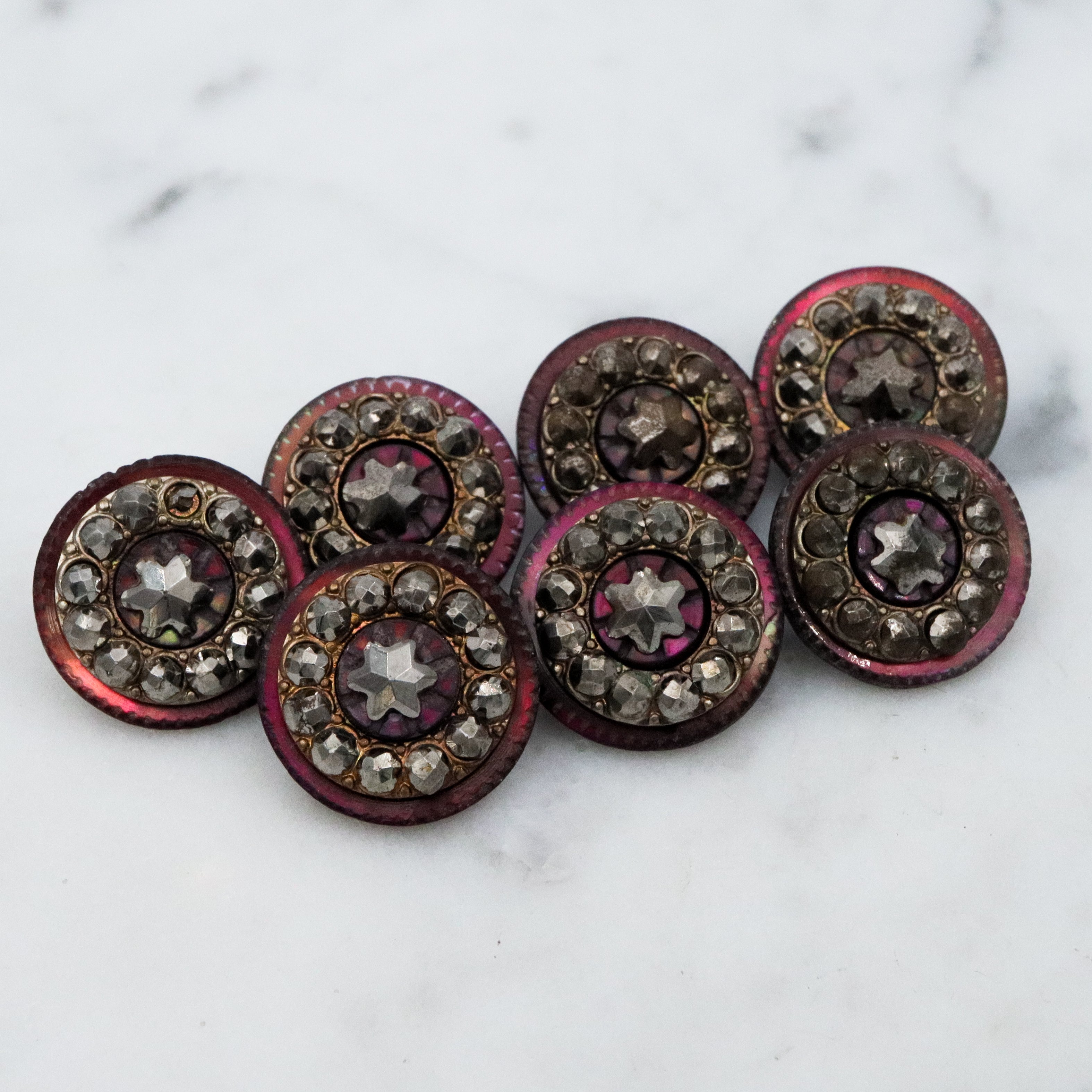 Set of 7 Antique Victorian purple shell cut steel rivet buttons